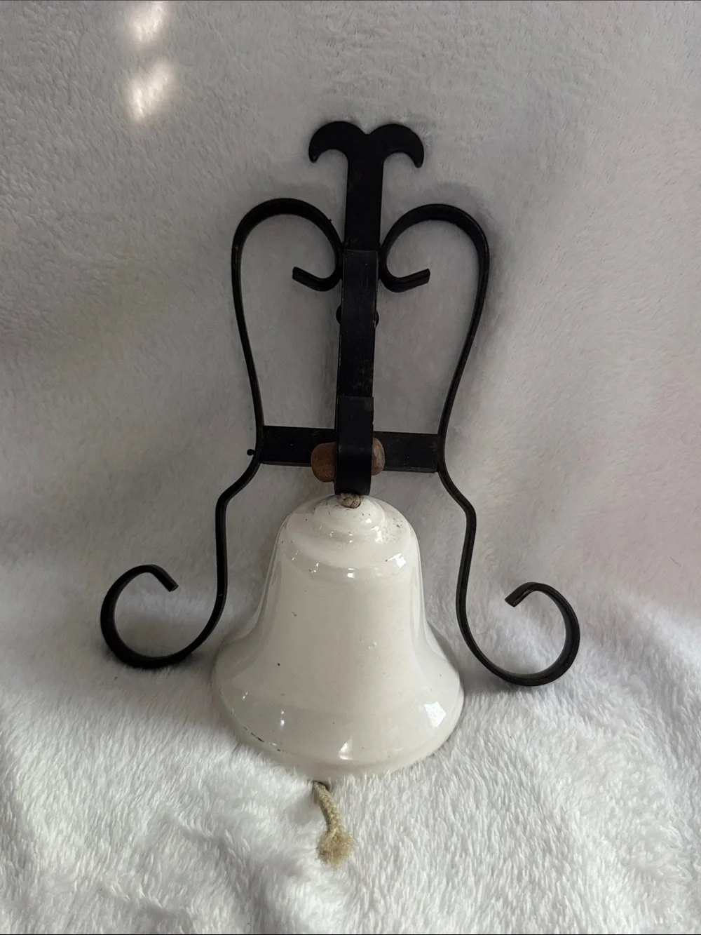 White Ceramic Bell Wall Decor with Black Iron Bracket